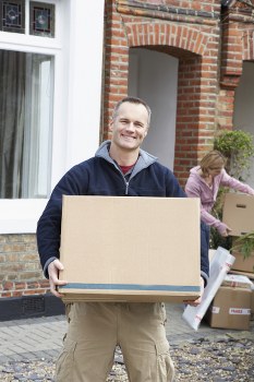 Movers preparing items safely for a Putney van service