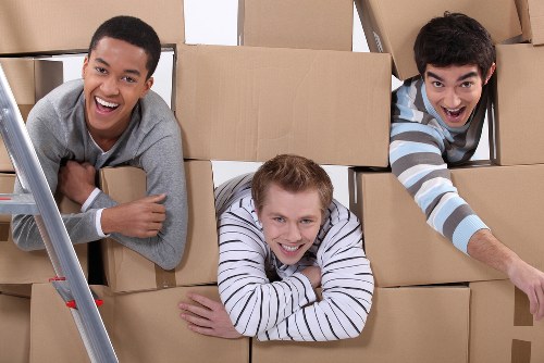 Local moving team loading furniture for a Putney removal