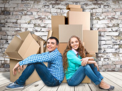 Unpacking and organising boxes in a Putney flat after relocation
