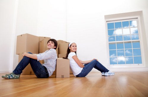 Local movers handling furniture in a Putney commercial property