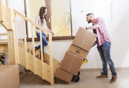 Movers handling household items during a Putney relocation