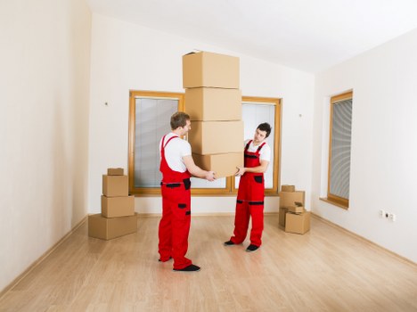 Local moving team packing fragile household items in Putney